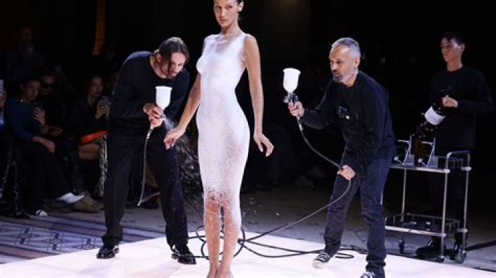 
Bella Hadid Gets White Dress Spray-Painted on Her Mid-Show During Paris Fashion Week 