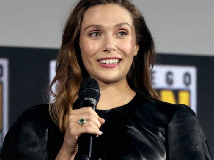 Elizabeth Olsen’s engagement ring is a big emerald with a diamond surround