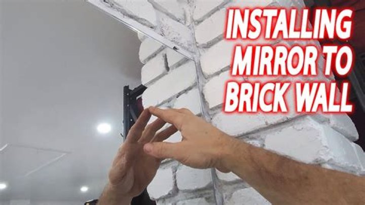 How do you hang a heavy mirror on brick?