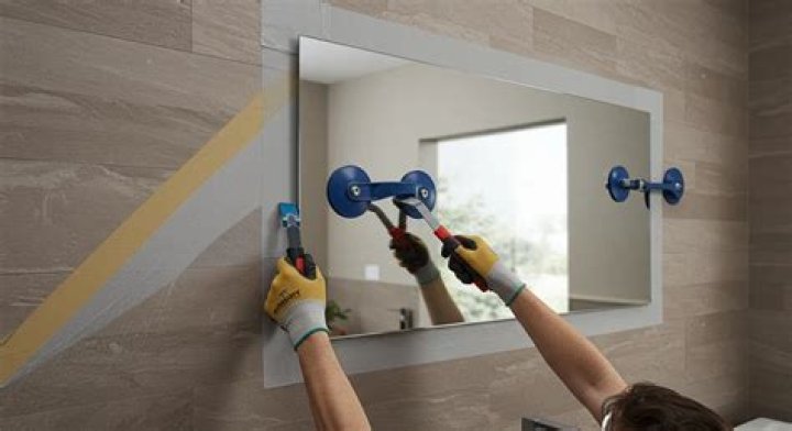 How do you remove mirror tiles from a wall?