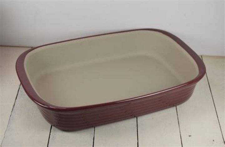 How do you season a Pampered Chef stoneware loaf pan?