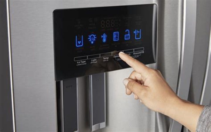 How do you unlock the controls on a GE refrigerator?