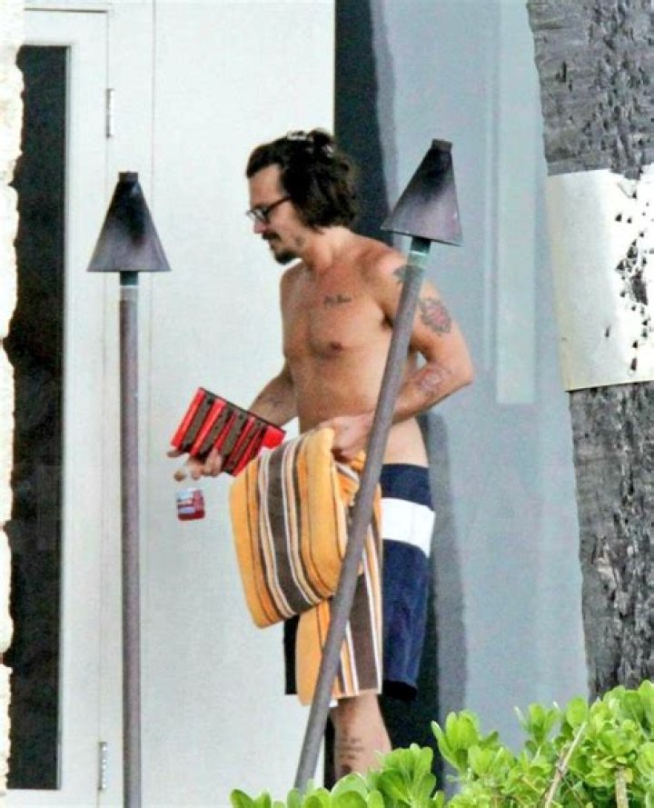 Johnny Depp, shirtless, GQ’s “Most Stylish Man”