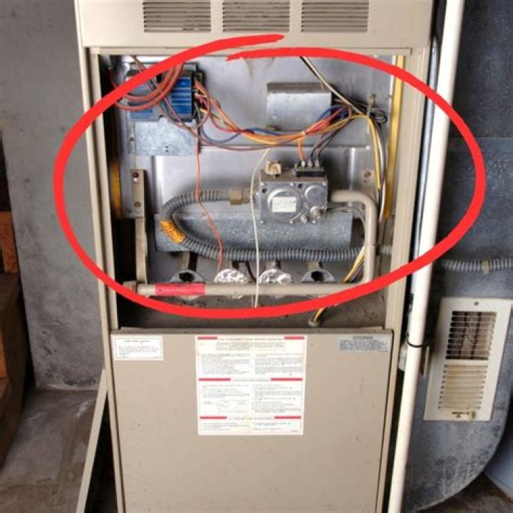 Where is the reset button on a Carrier heat pump?